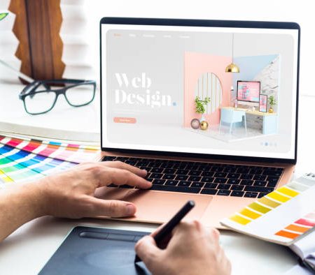 Web design desktop with  laptop and tools