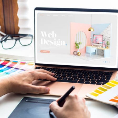 Web design desktop with  laptop and tools